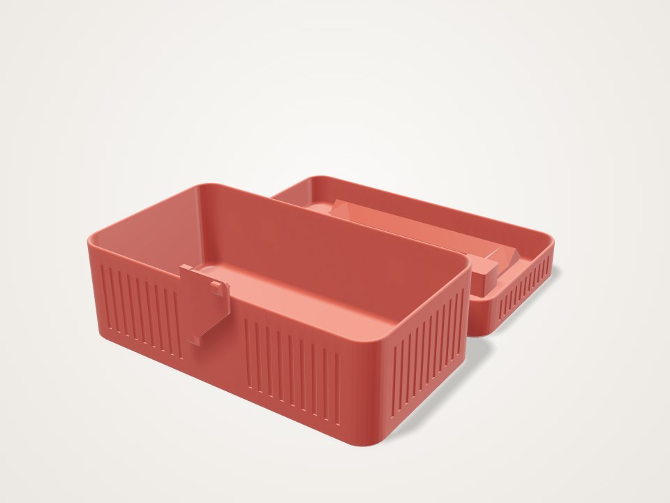 Red rectangular toolbox with ribbed sides and its hinged lid opened flat behind the base