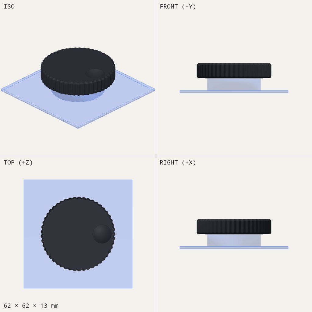 Wide dark fluted dial with a small round spinner knob near the edge, sitting on a flat square plate