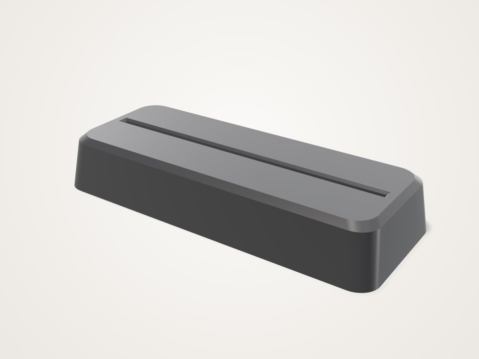 Low dark rectangular base with a long narrow slot running along the top
