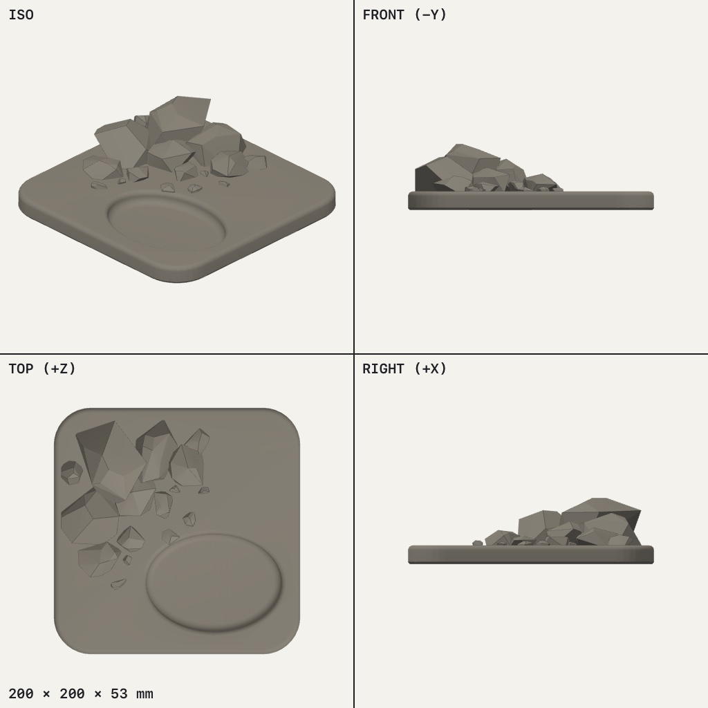 Rounded square base with a heap of angular rocks in one corner and a shallow oval dip