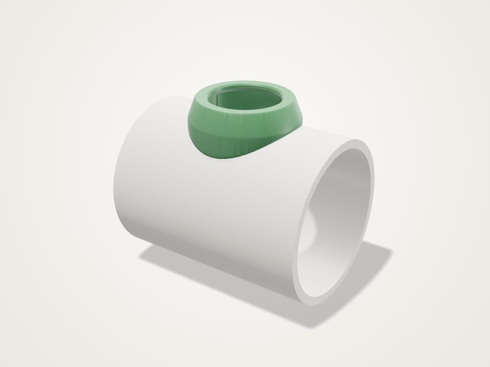 Green collar with a round opening sitting on the side of a white pipe
