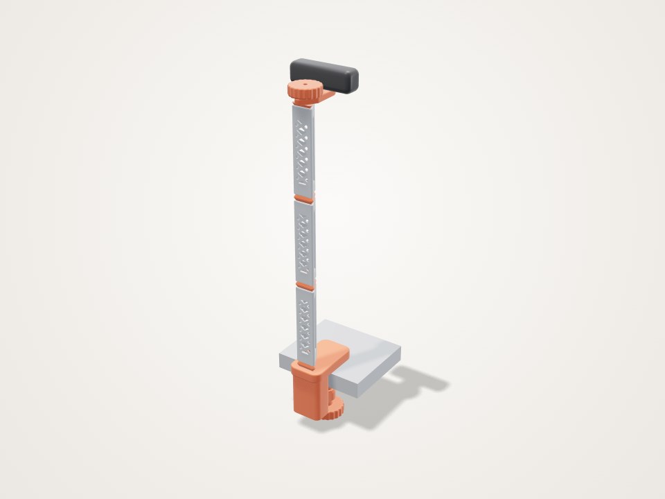 Tall slim lattice pole clamped to a desk edge with a camera mount at the top