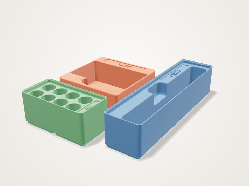 Gridfinity junk-drawer bins with label tabs, a 3D printable design