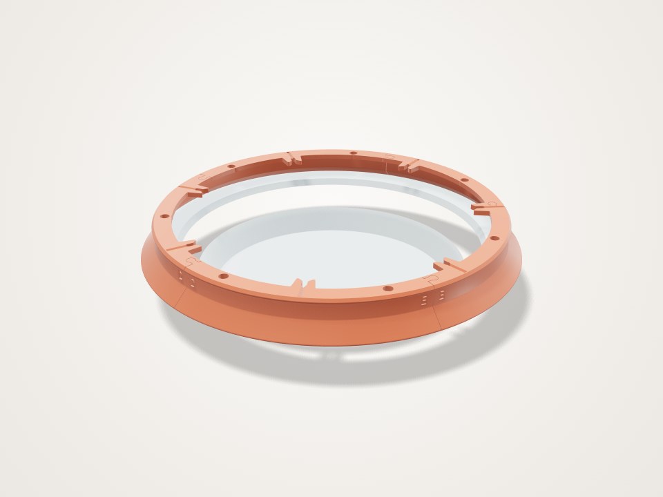 Orange ring with evenly spaced notches and small holes around the top, flared at the base